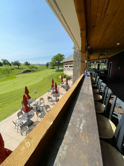 Bar seating looking onto the putting green
